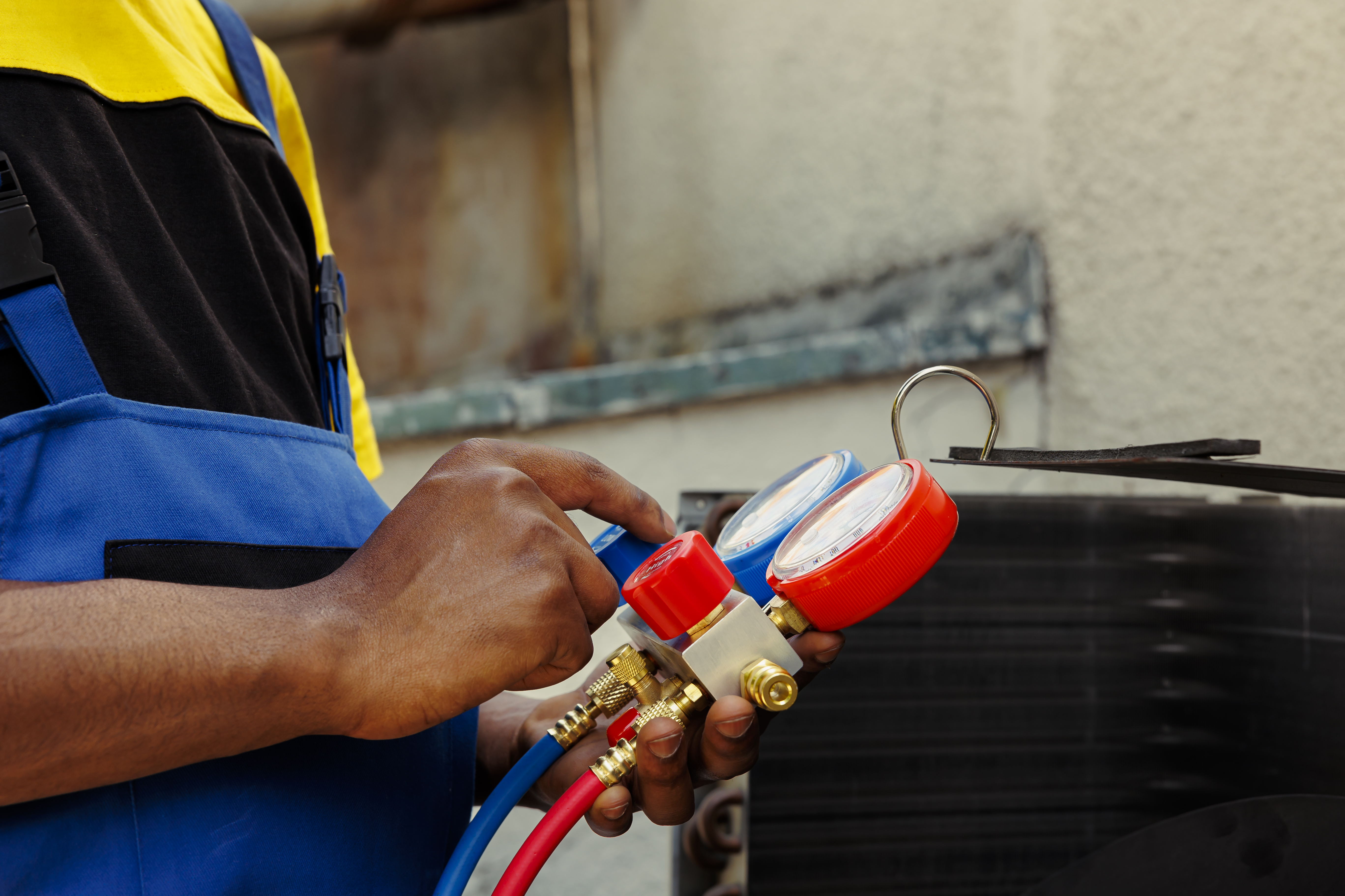 HVAC technician checking Freon levels