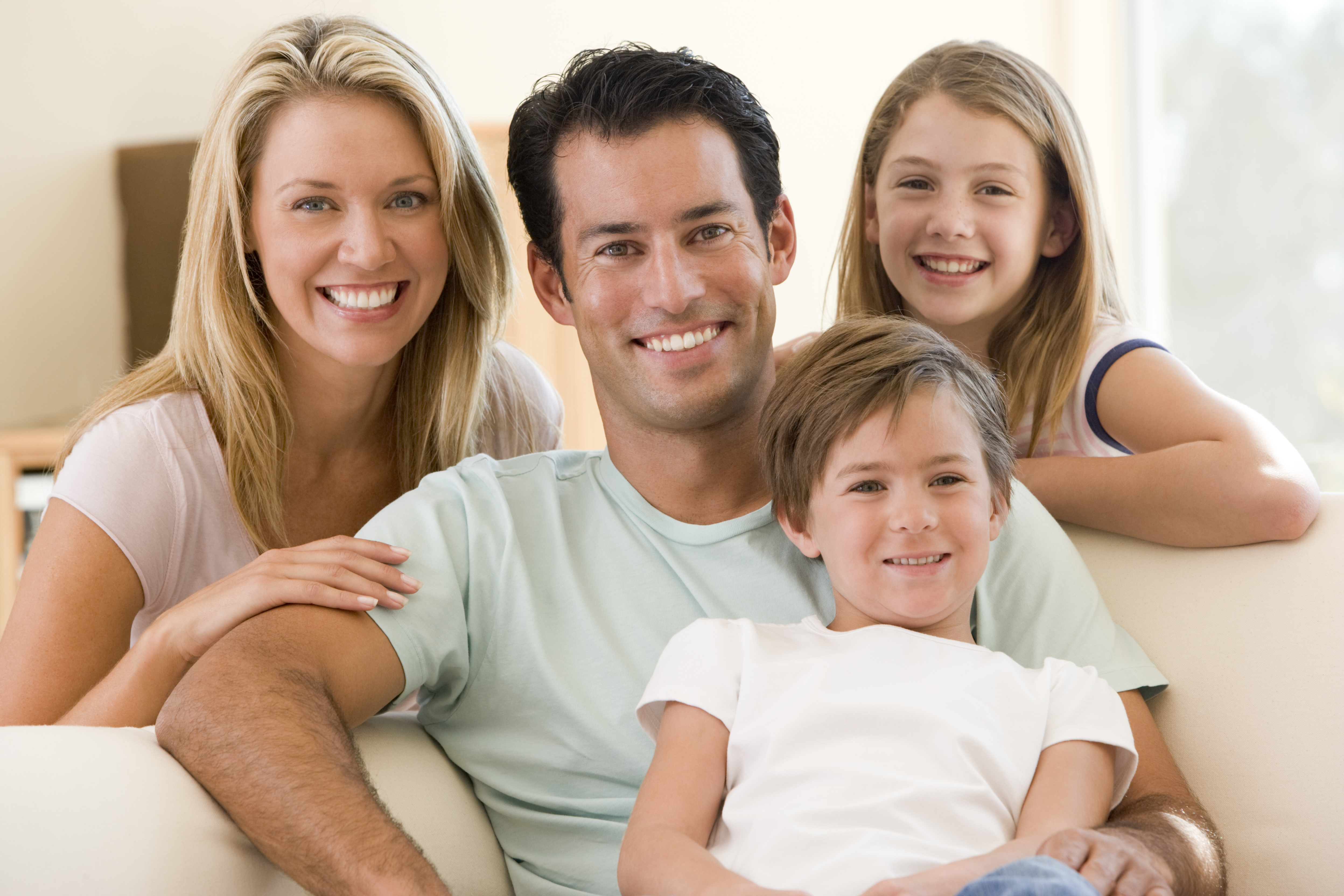 A satisfied family of ABC Plumbing customers after dealing with excessive humidity in their home.