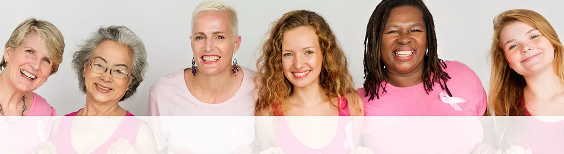 Image of six woman of different ages and races, all wearing pink shirts