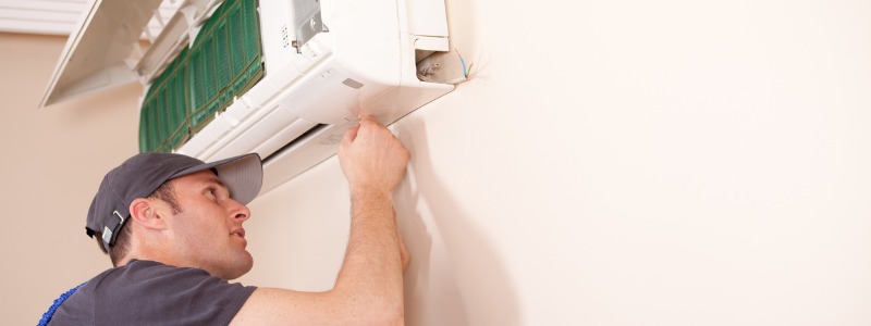 technician repairing a ductless mini-split